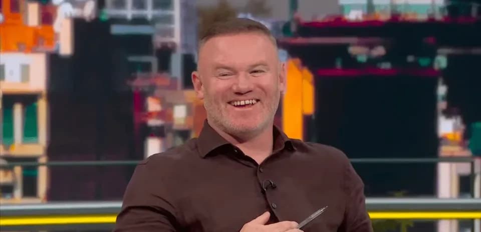Former player smiling during sports discussion segment