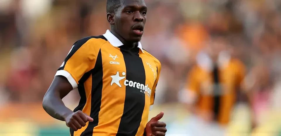 Player running on the field in team jersey