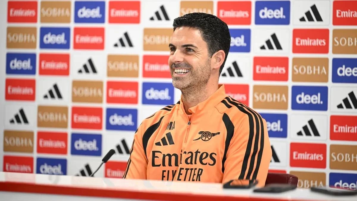 Manager at press conference with sponsor backdrop
