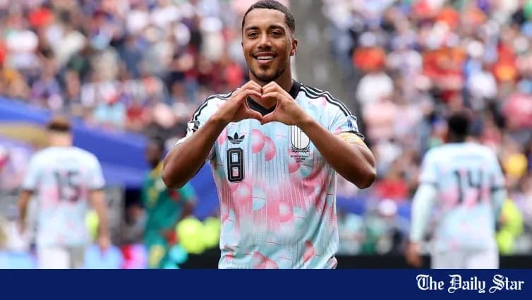 Player celebrating by forming a heart shape with hands