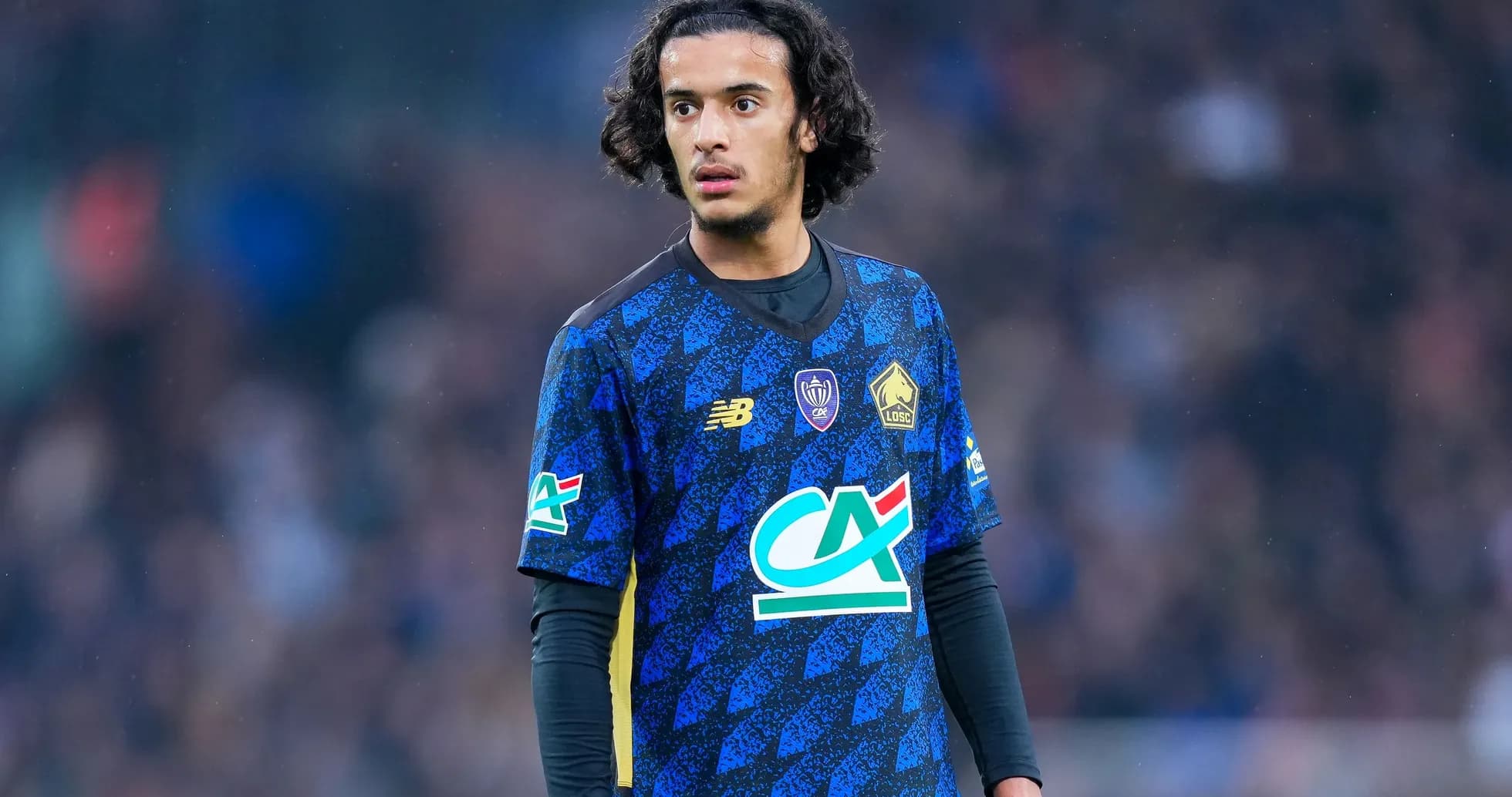 Player wearing blue jersey on the field