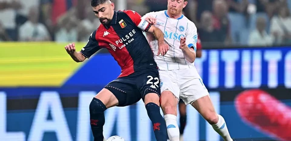 Two players competing for the ball during match