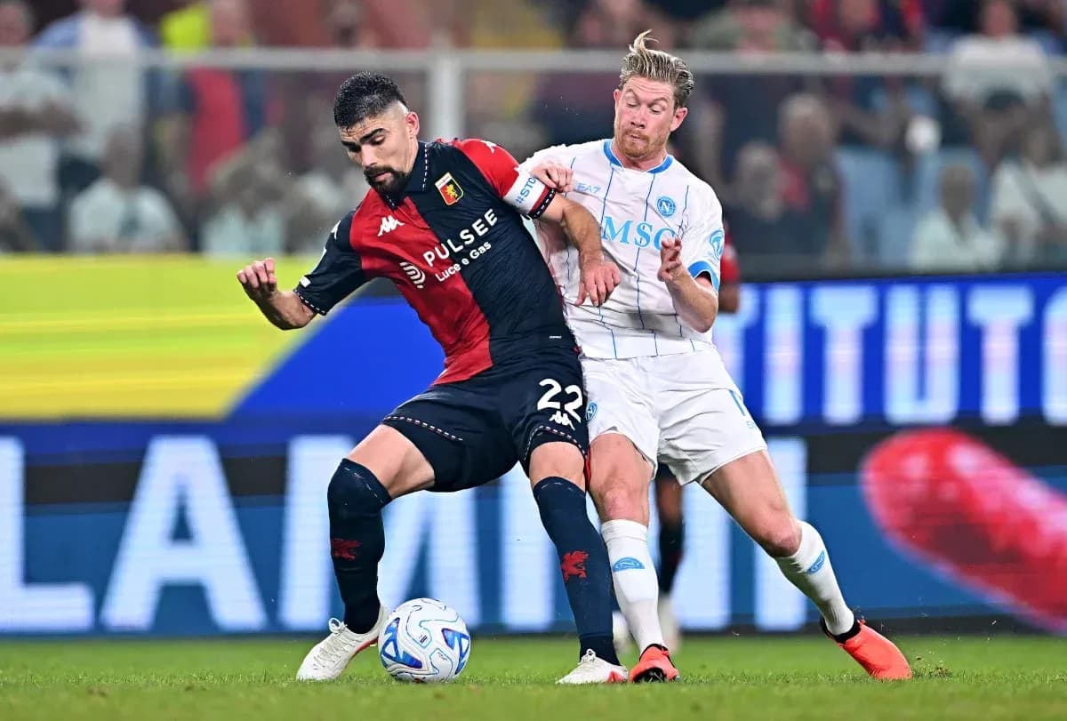 Two players competing for the ball during match