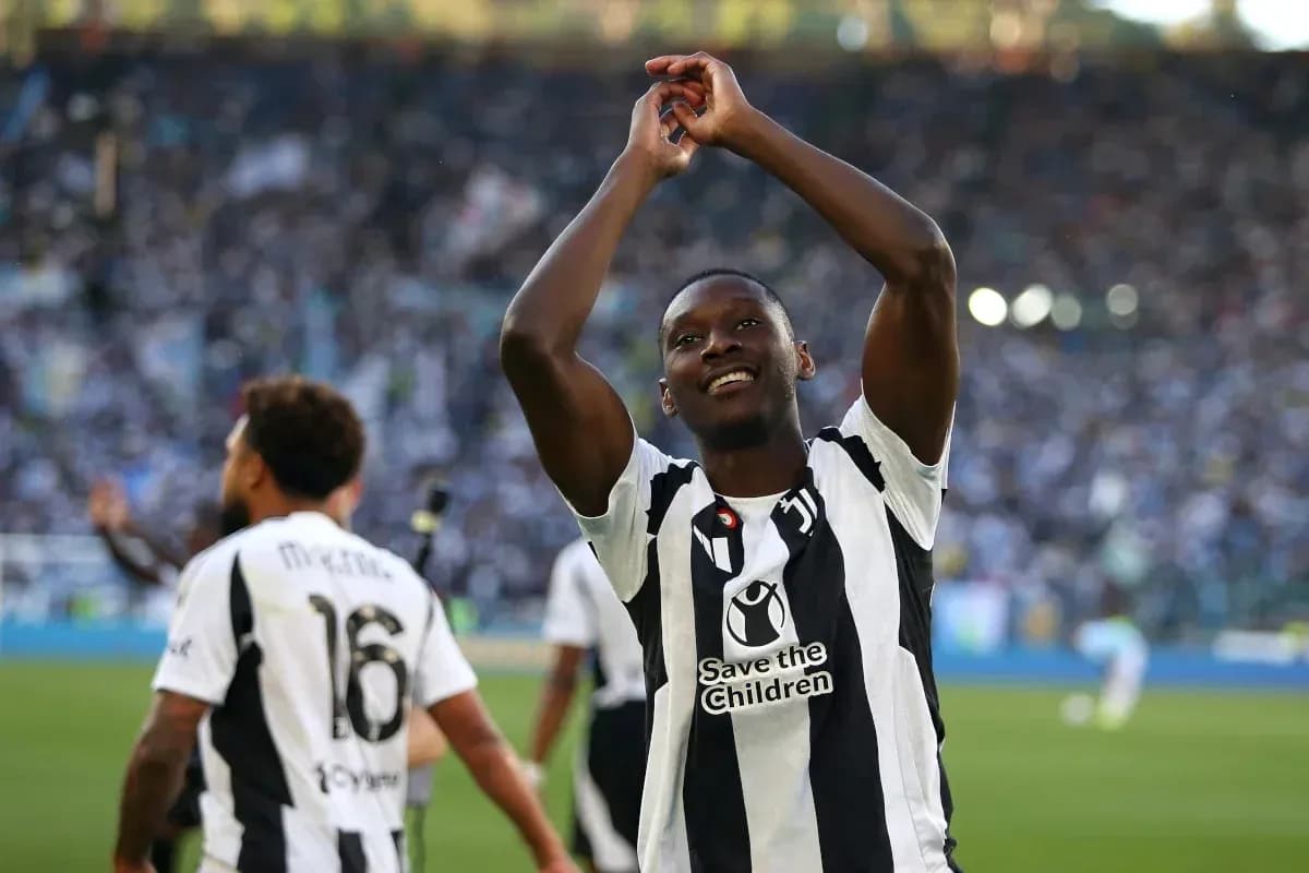 Player celebrating in front of cheering crowd