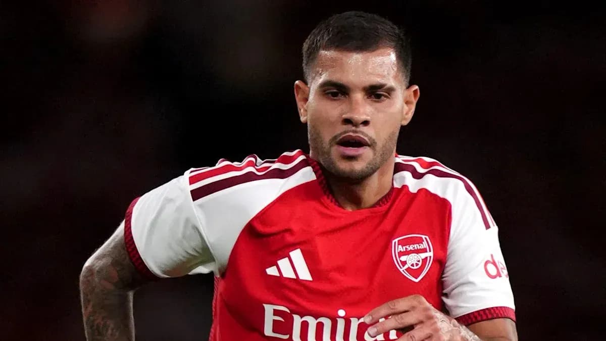 Player wearing Arsenal kit running on the pitch