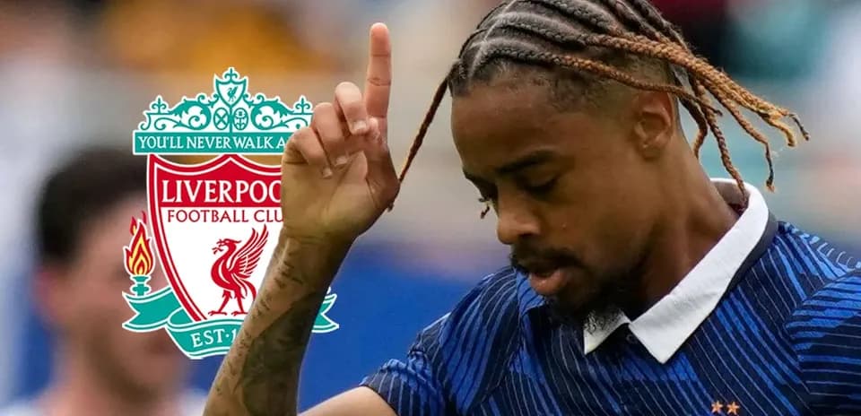 Player gesturing during match with Liverpool logo