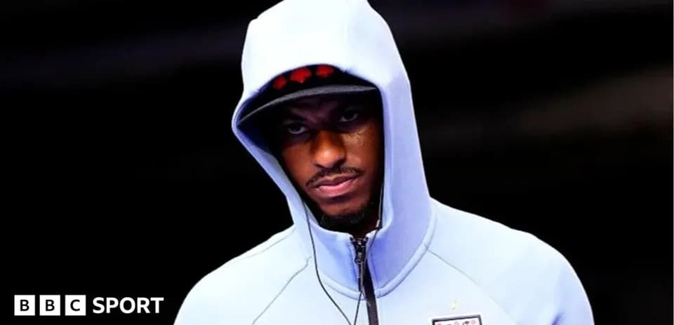 Player wearing a hoodie before a match