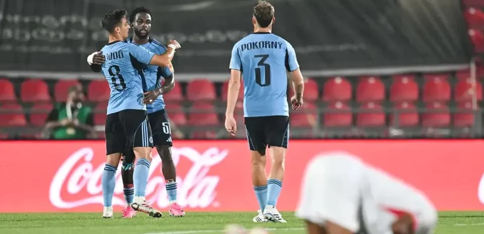 Players celebrating a goal during football match