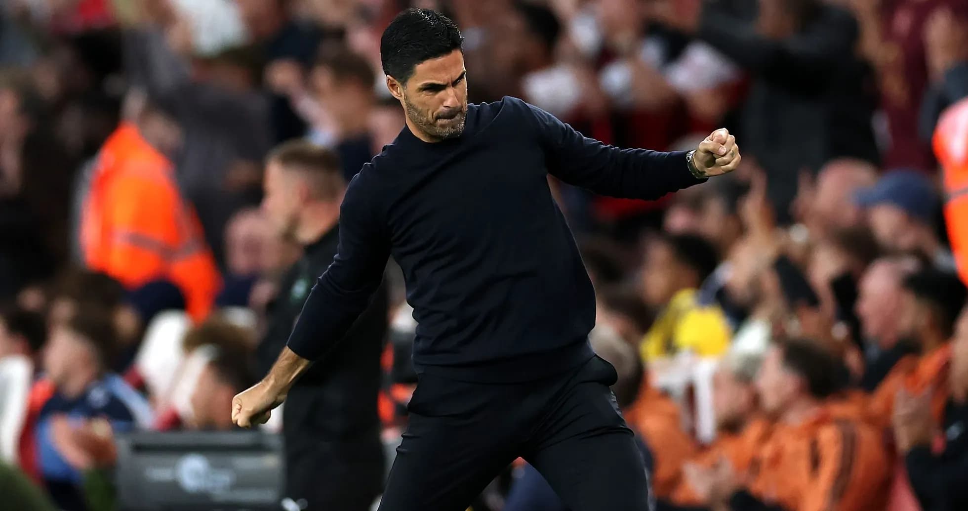 Manager celebrating during a match at the stadium