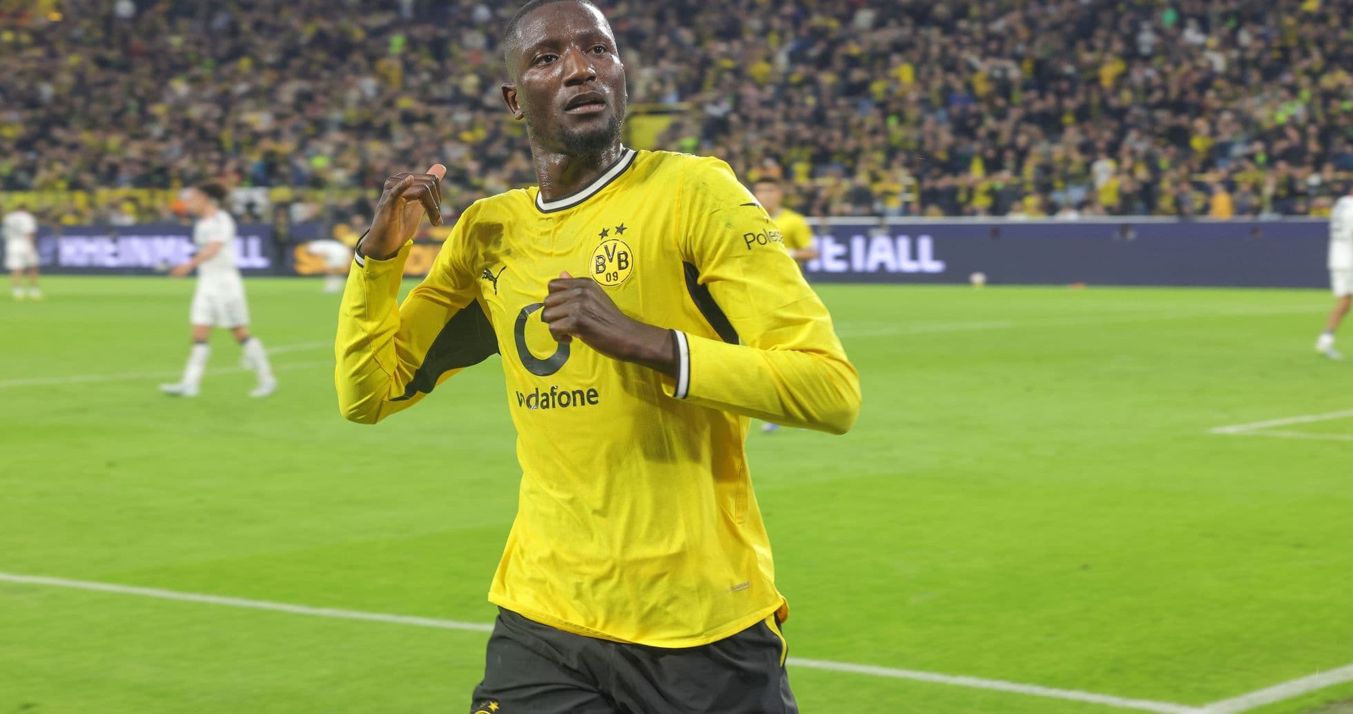 Player celebrating a goal in yellow jersey