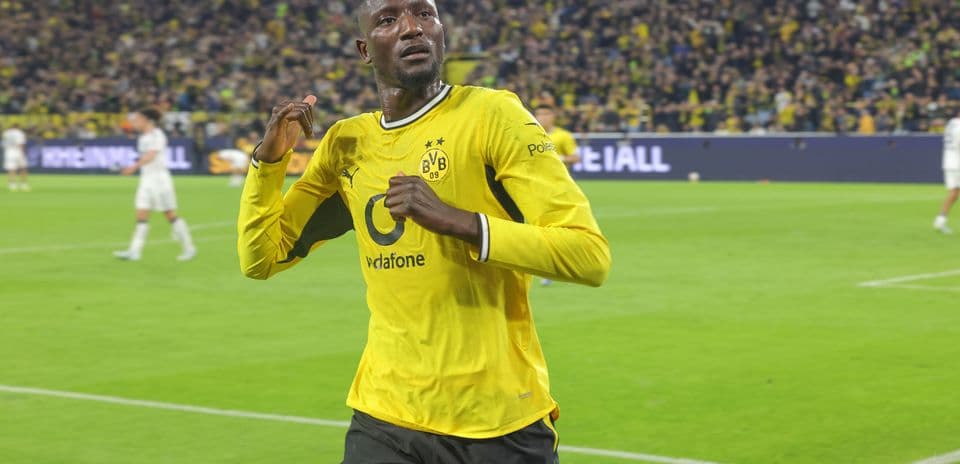 Player celebrating a goal in yellow jersey