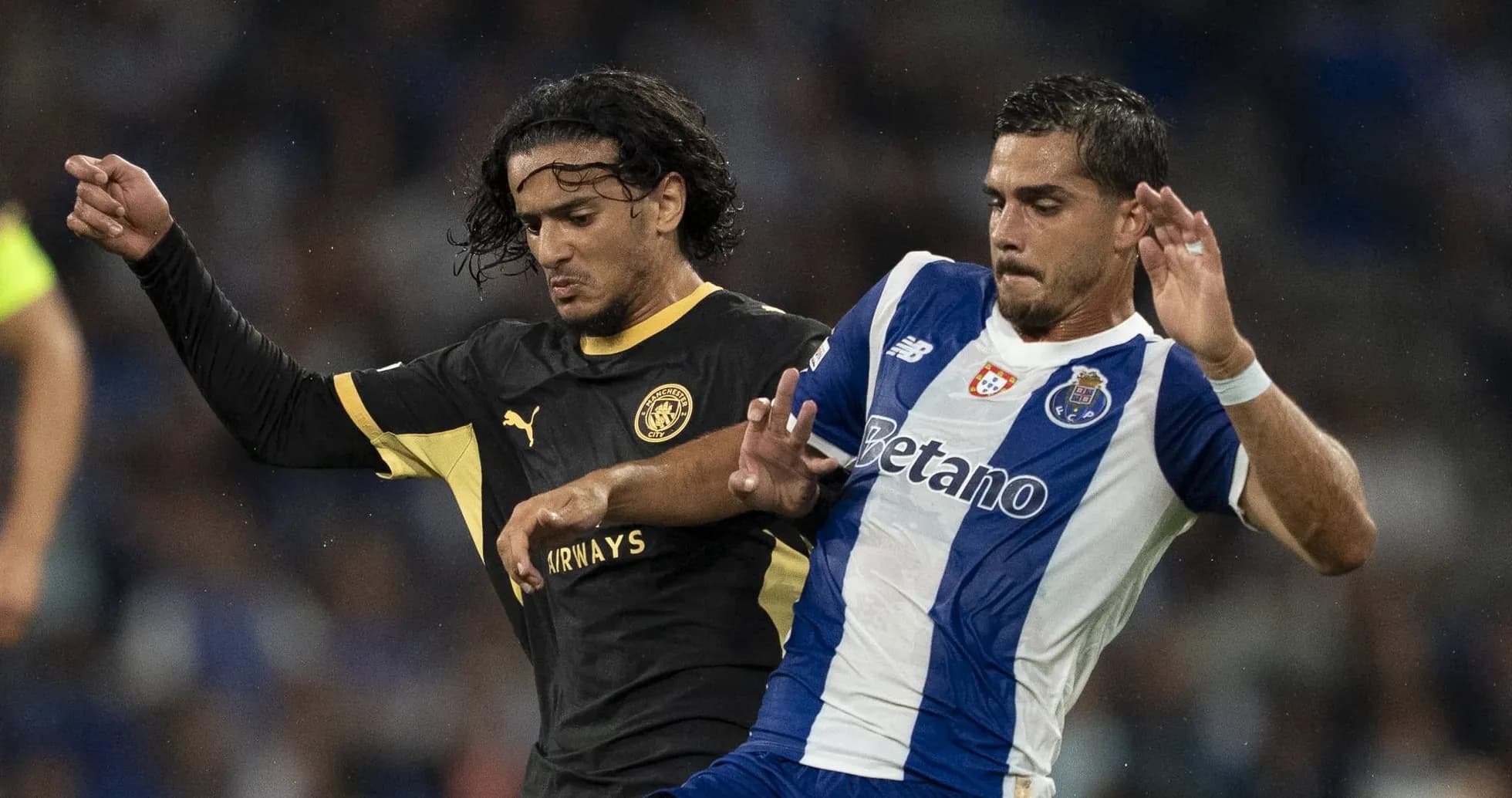 Two players battling for possession during a match