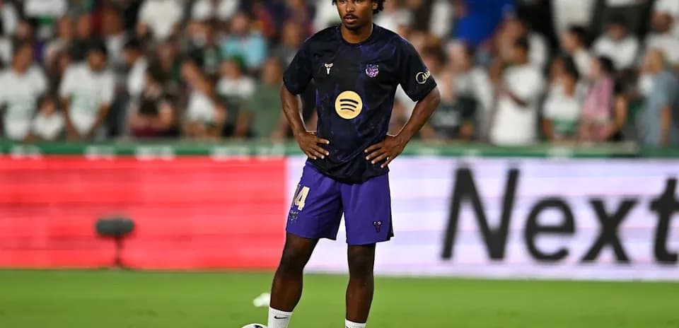 Player standing with ball during match preparation