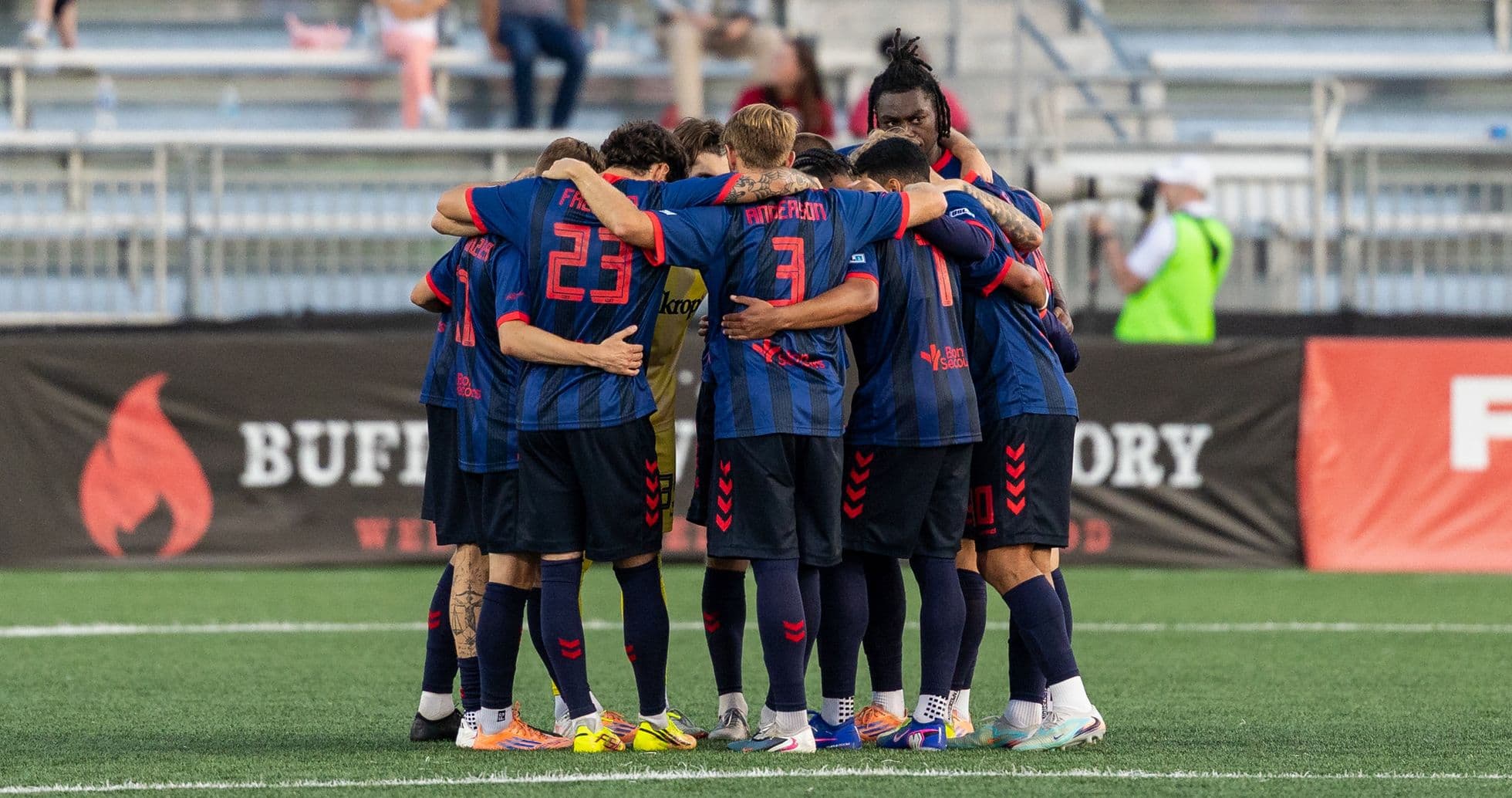 Players huddling before the match