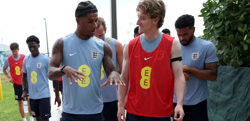 Players conversing during training session outdoors
