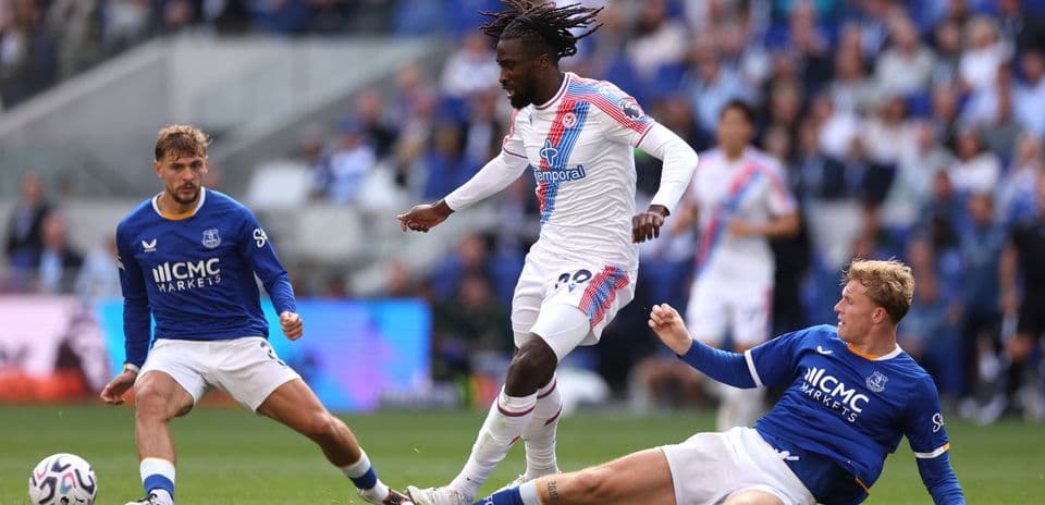 Player dribbling past opponents during match