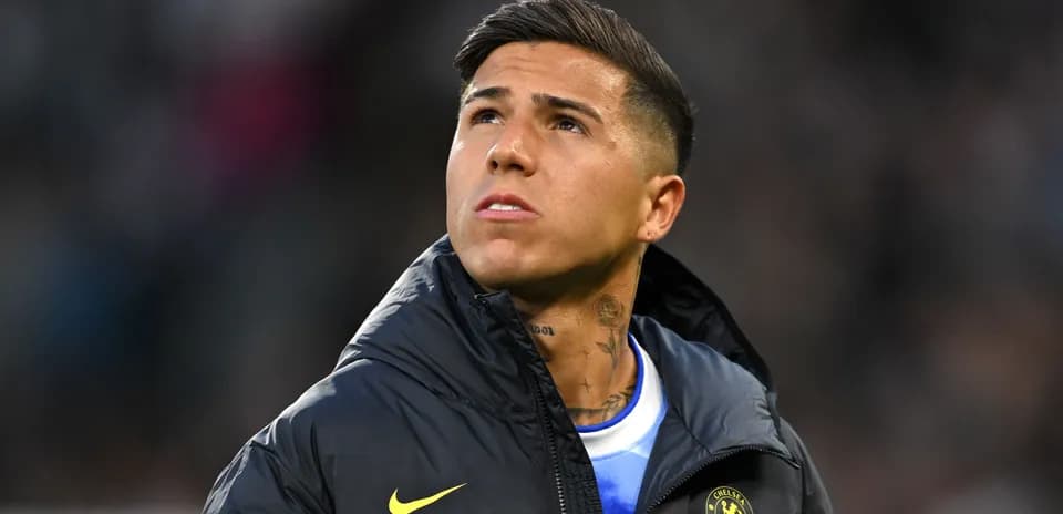 Player looking up while wearing a Chelsea jacket