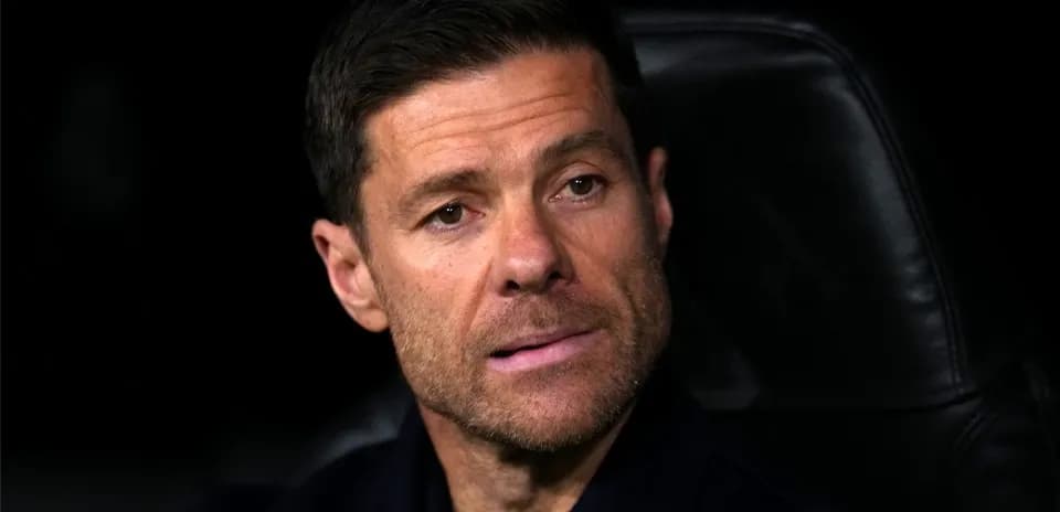 Coach seated on the bench during a match