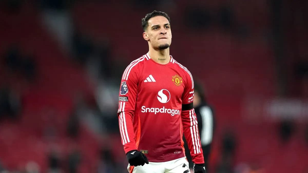Player celebrating on the pitch in Manchester United kit