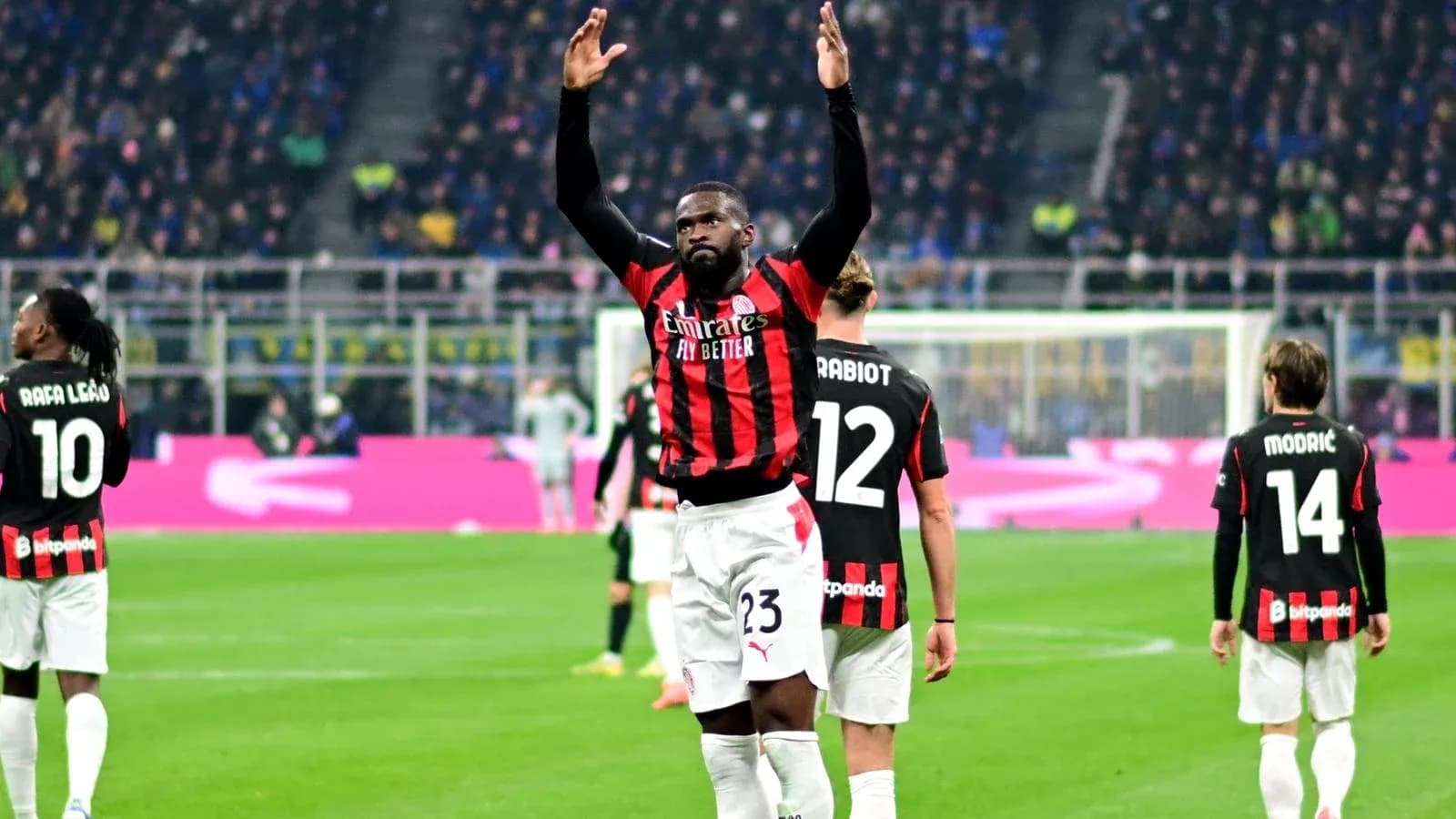 AC Milan players celebrating on the pitch