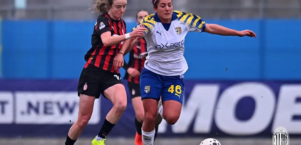 AC Milan player contesting the ball with Parma player