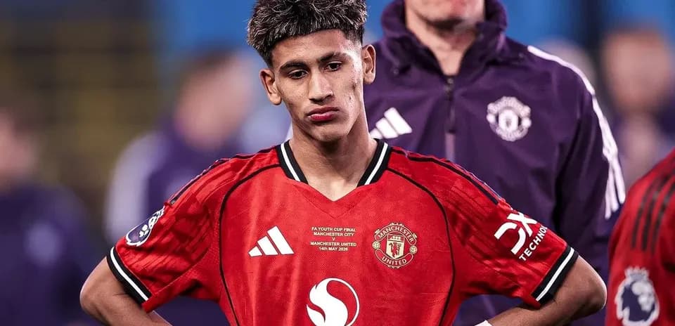 Manchester United player looking down after match