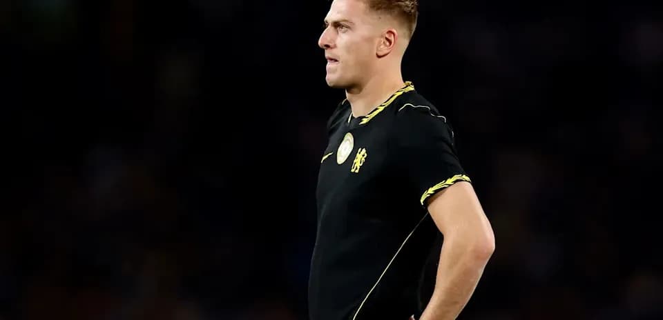 Player in black jersey standing on the field