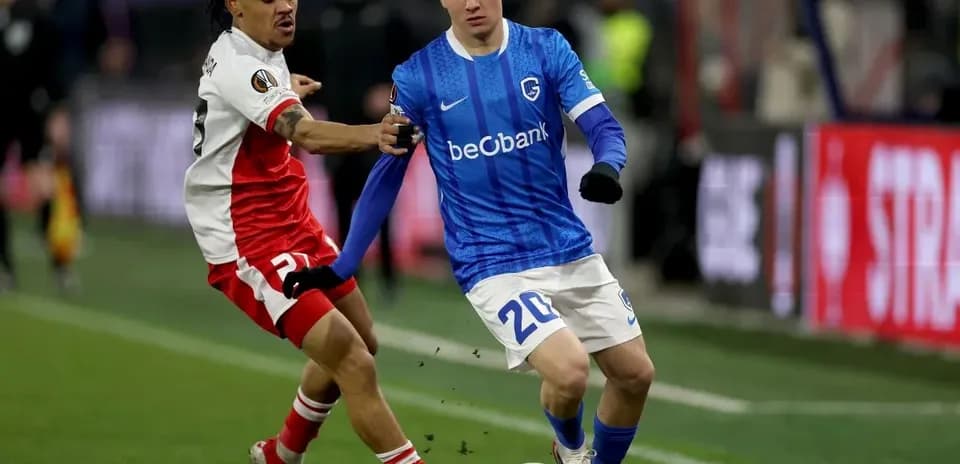 Two players competing for the ball during match