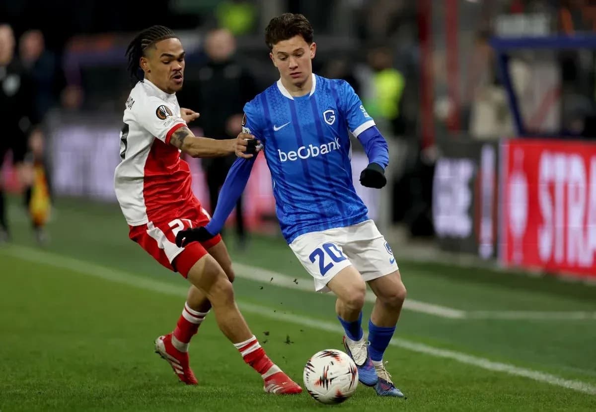 Two players competing for the ball during match