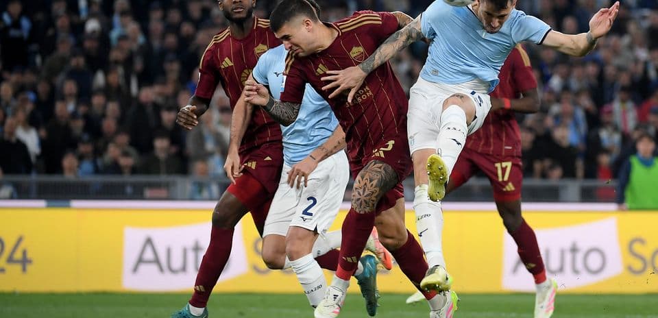 AS Roma players contesting a header against Lazio