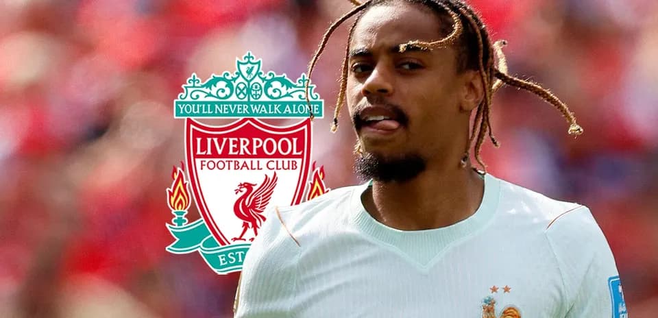 Player running on the pitch with Liverpool logo