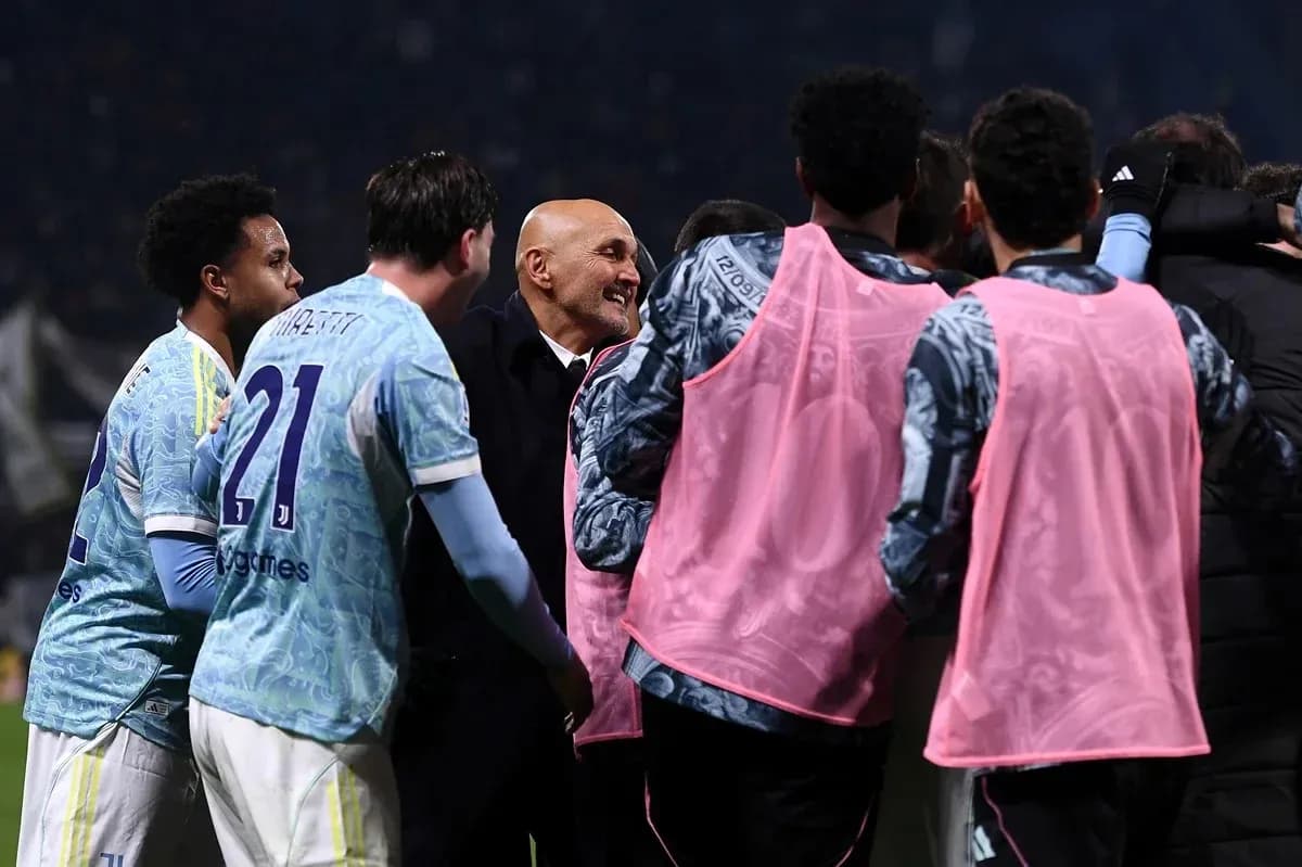 Team celebrating with coach after match victory