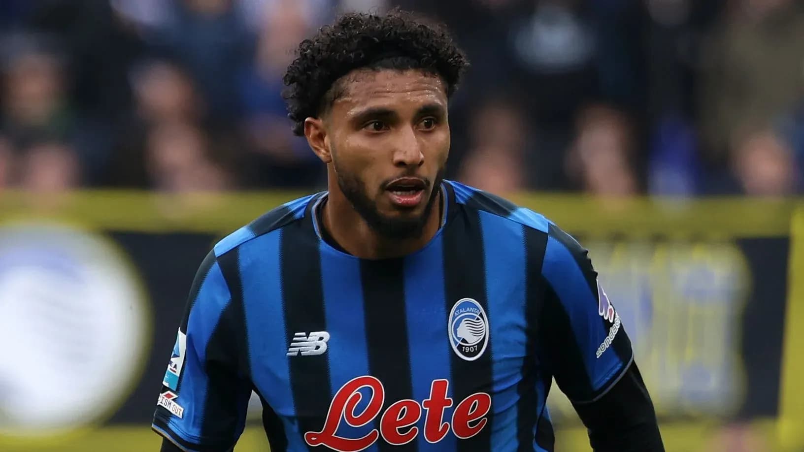 Player in blue and black striped jersey during match