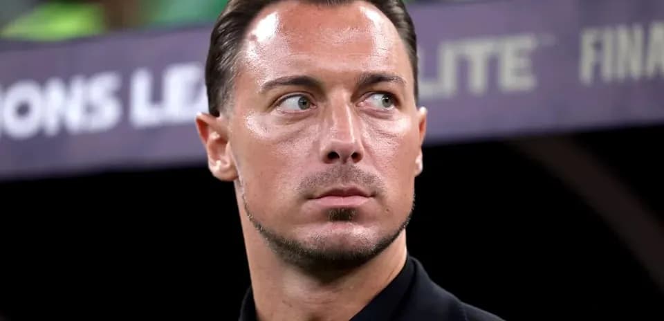 Coach observing during UEFA Champions League match