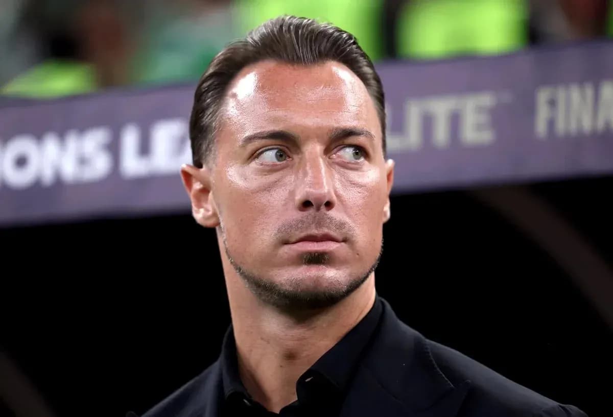 Coach observing during UEFA Champions League match