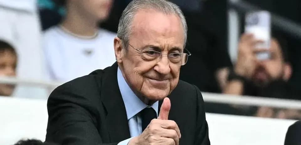 Club president giving thumbs up in stadium