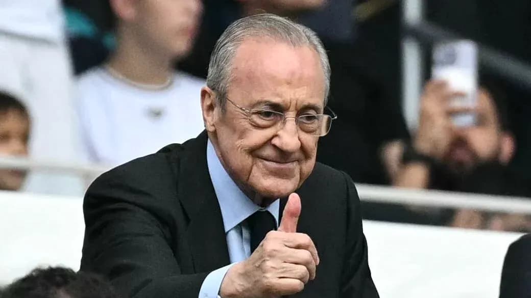 Club president giving thumbs up in stadium