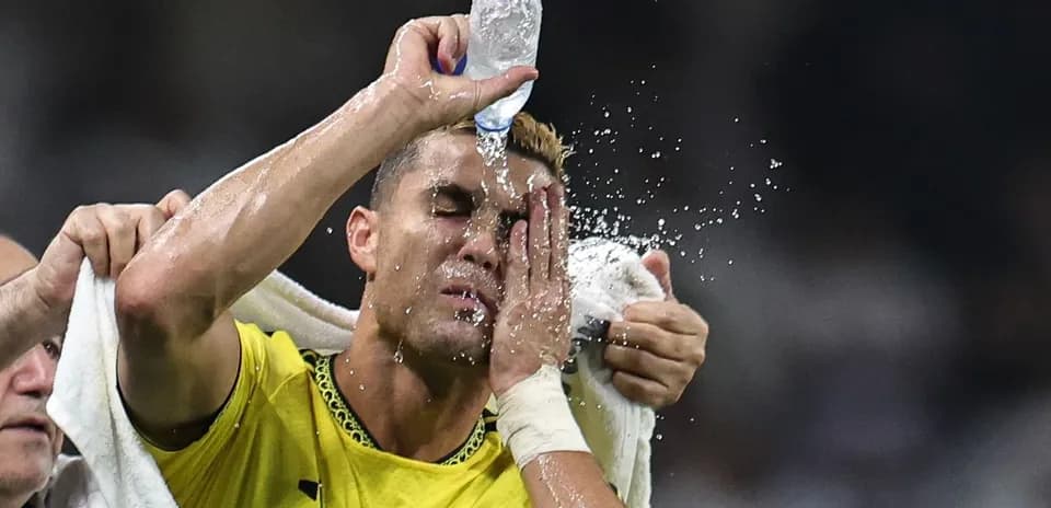 Player cooling down with water during match