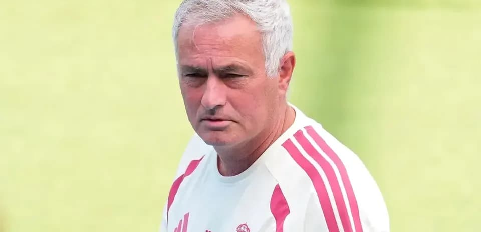 Coach in Real Madrid training gear on field