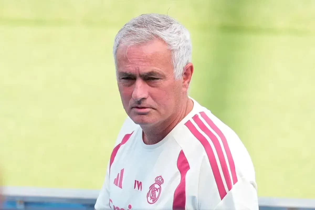 Coach in Real Madrid training gear on field