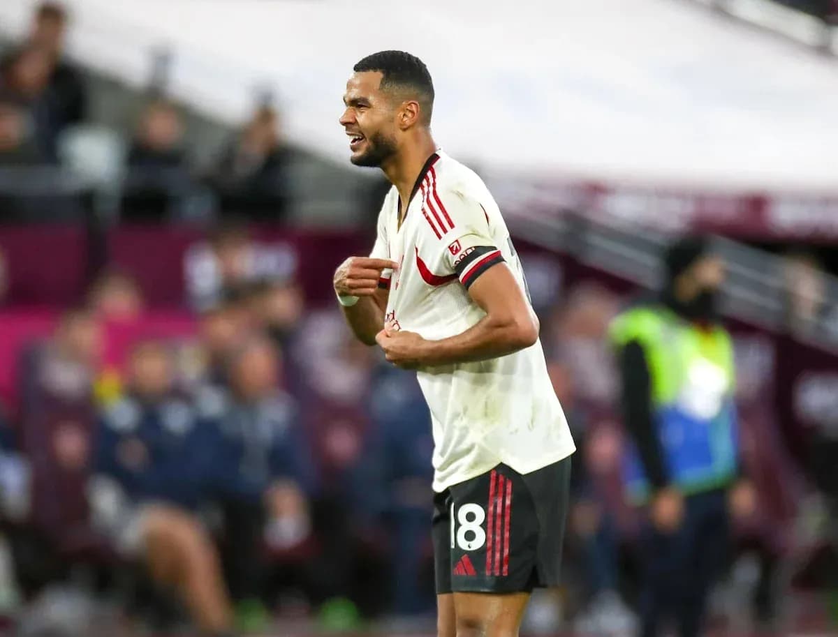 Player reacting during match wearing team jersey