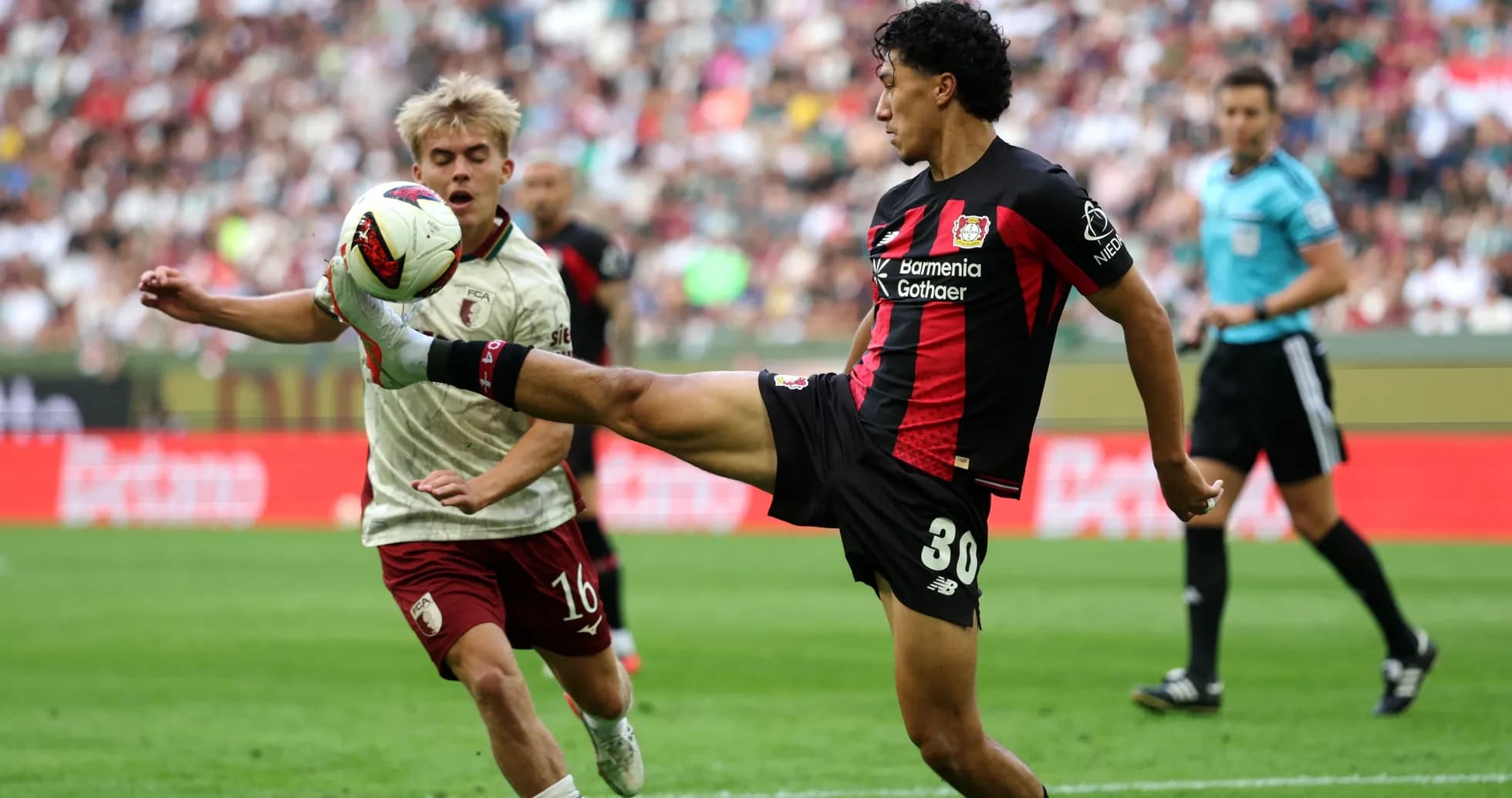 Player kicking the ball during a match action
