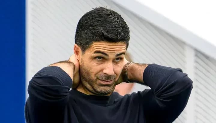 Manager adjusting his collar during training session