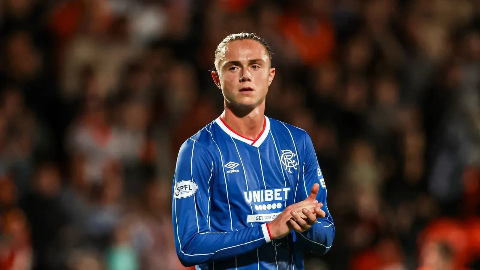 Player applauding fans after the match