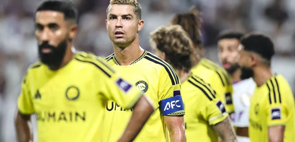 Players in yellow uniforms during a football match