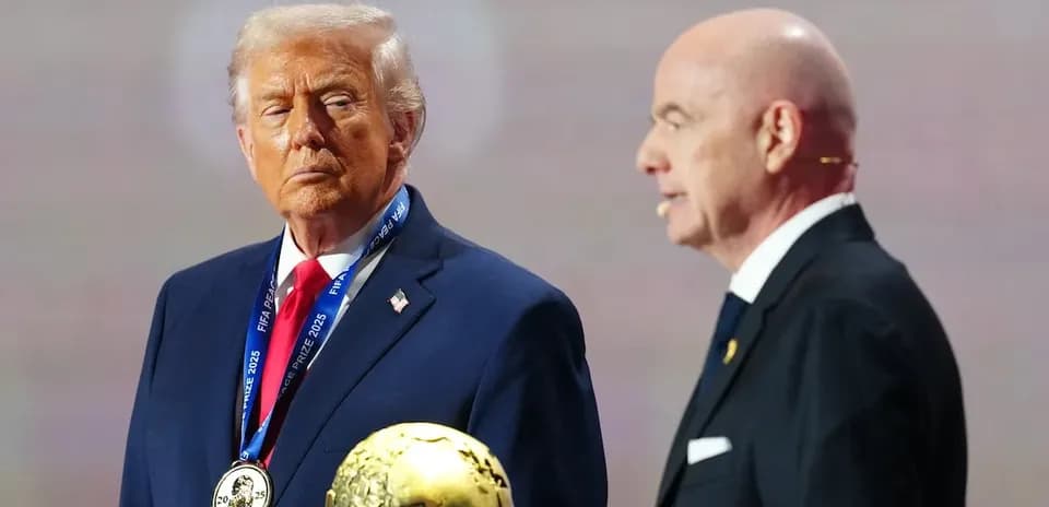 Two men at an award ceremony with trophy