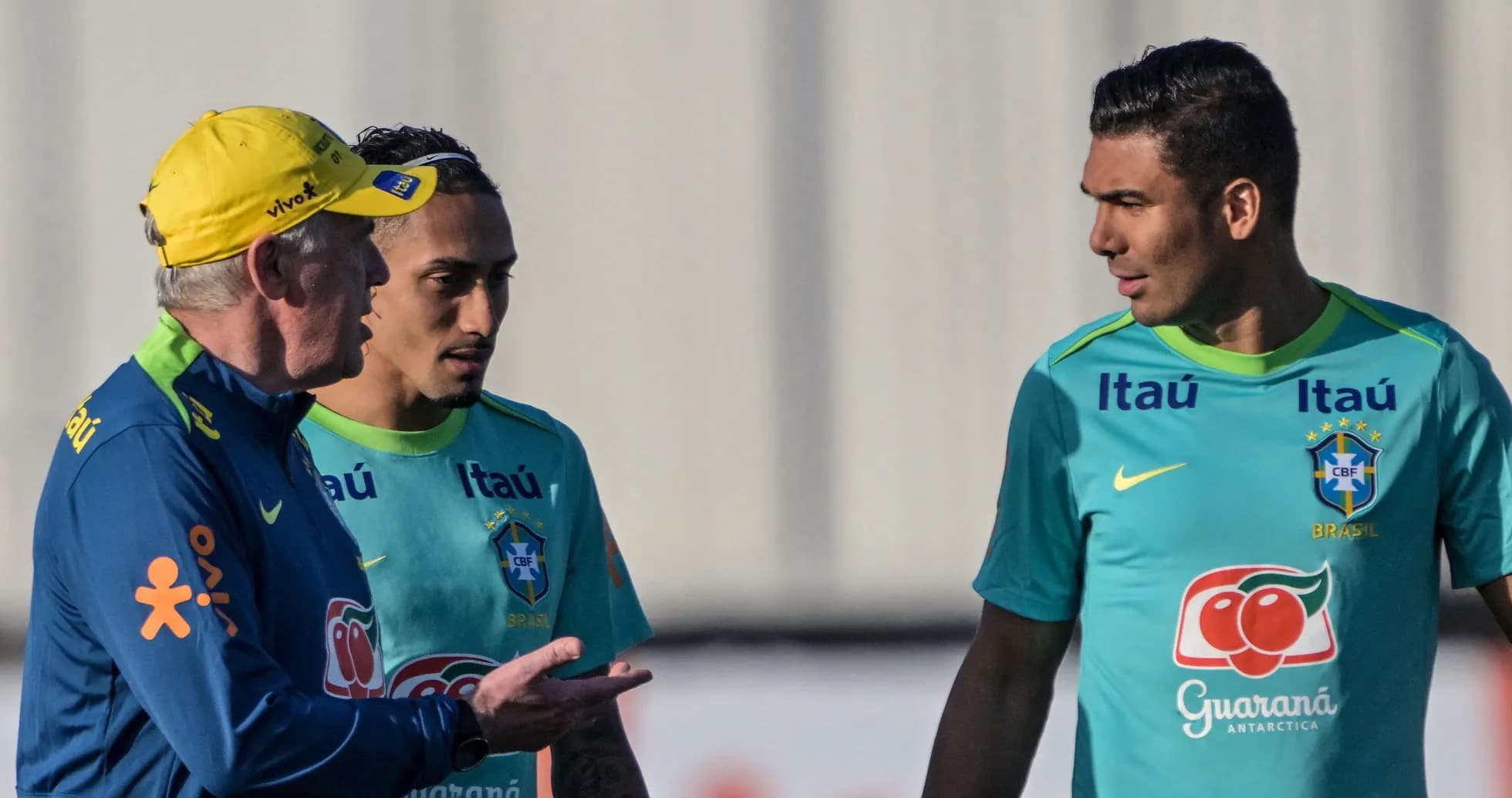 Coach discussing tactics with Brazilian players during training