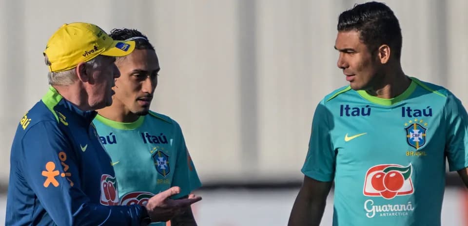 Coach discussing tactics with Brazilian players during training