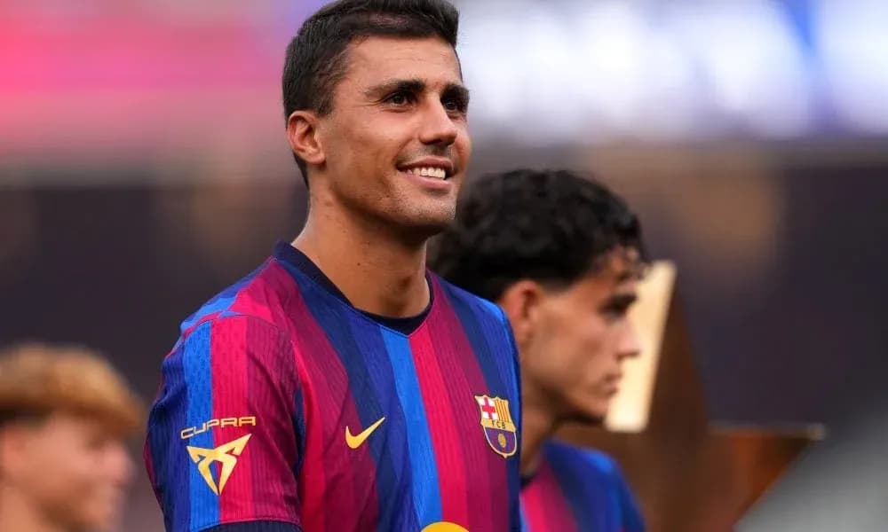 Player smiling during trophy celebration ceremony