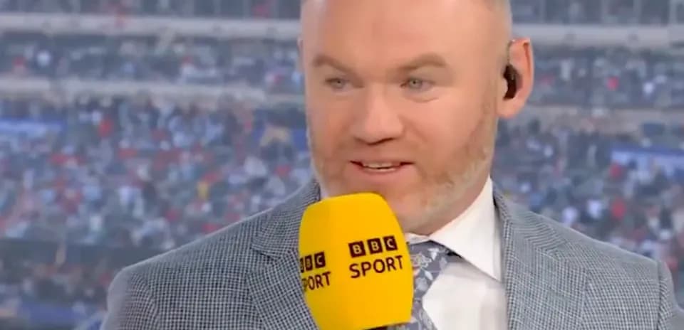 Presenter speaking into microphone during live broadcast